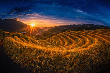 Rice fields on terraced with milky way at sunset in Mu Cang Chai, YenBai, Vietnam. clipart
