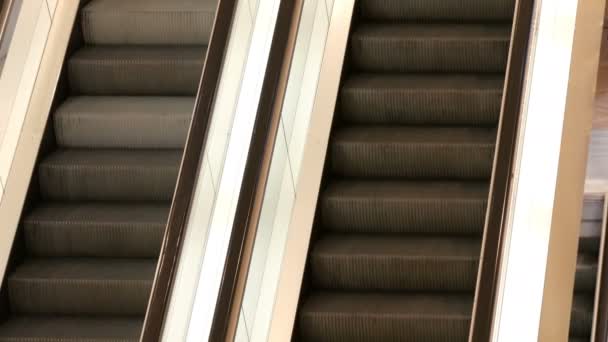 Two escalators in shopping centre which move up one another down close up view. — Stock Video