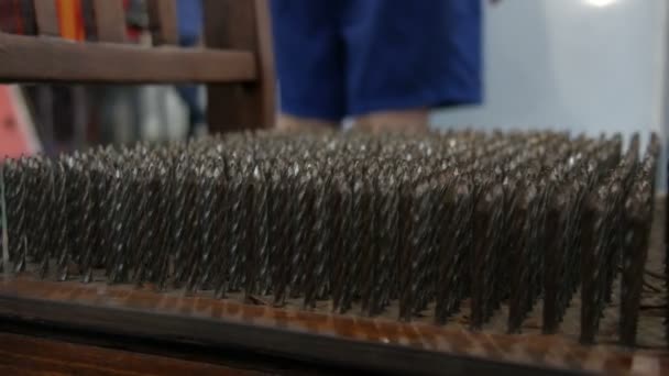 Chair with metal spikes or with iron nails on a seat close up view. Concept of physics. Museum of Science — Stock Video