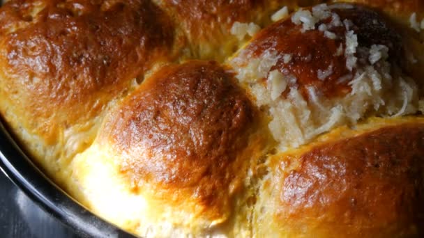 Freshly baked roast dough on baking sheet only from the oven. Hot steam on Ukrainian national dumplings with garlic. Homemade baking — Stock Video