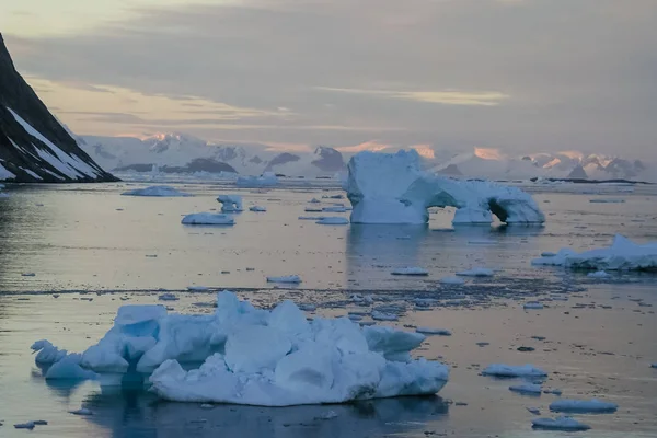 Antarctic icebergs in the waters of the ocean. Antarctic landscape Antarctic icebergs in the waters of the ocean. Antarctic landscape