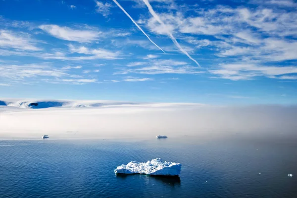 Arctic iceberg in the ocean. Arctic landscape, arctic tundra and ice of the Arctic Ocean.