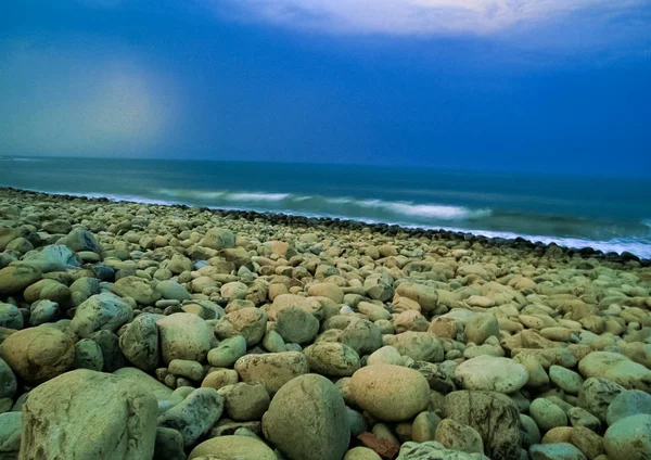 Round stones on the seashore. Round stones on the seashore.