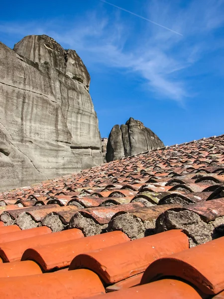 old roof tiles reinforced with cement. Meteora monasteries on the rocks in Greece, ancient architecture