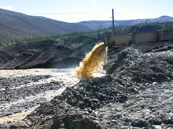 Gold mining, washing ore.