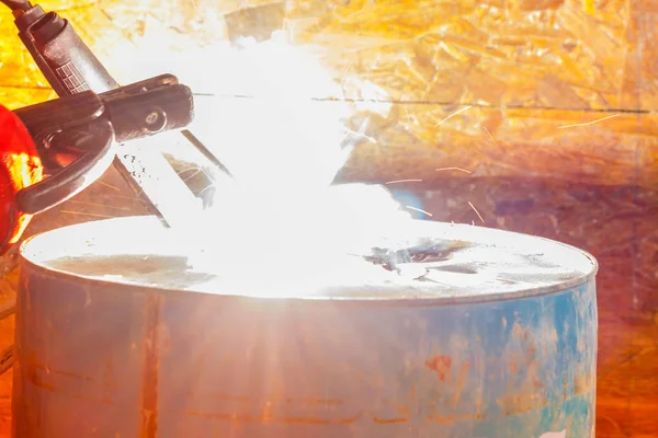 Worker with red glove to protect spark light with welding Proces Royalty Free Stock Photos