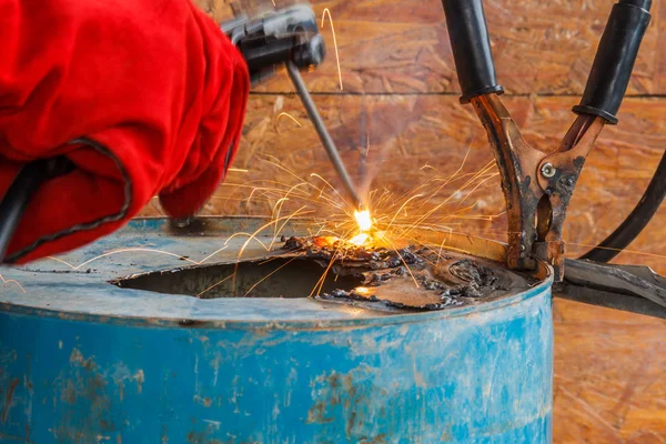 Worker with red glove to protect spark light with welding Proces Stock Picture