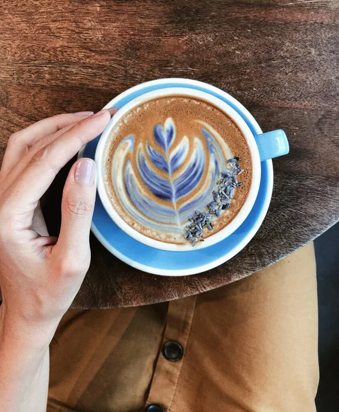 Beautiful Woman Hand Holding Big Blue Mug Coffee Top View — Stock Photo, Image