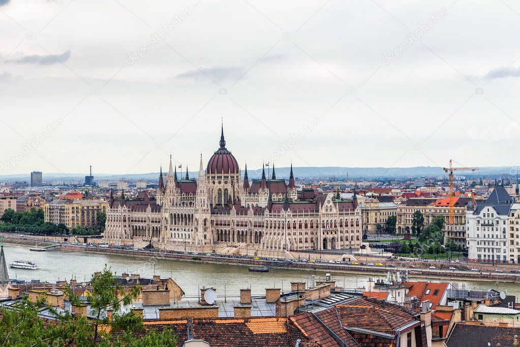 View from above on the Budapest city and Hungarian Parliament Building on the bank of the Danube river.