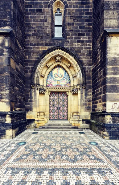 Gothic ornamented entrance doors to Basilica of St. Peter and St. Paul. Prague, Czech Republic