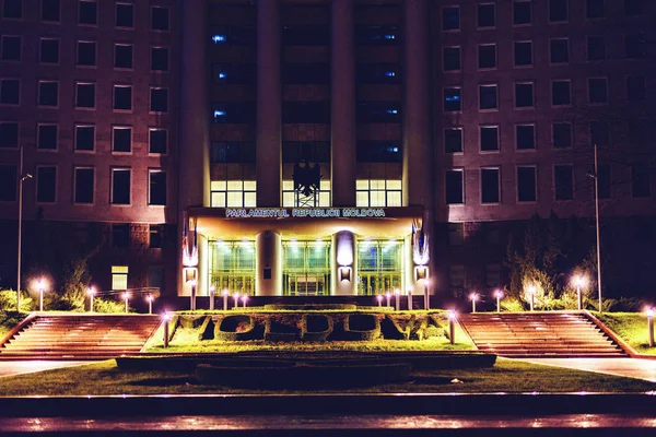 Parliament of Moldova at night. Bright lights glowing outside. Negative copy space, place for text. Chisinau, Moldova