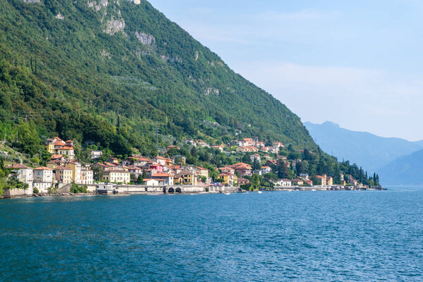 Fiumelatte town from side view. Lake Como and mountains on background. Italy beauties