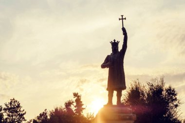 Stephen the Great Monument in the city center, against the background of the sunset, Chisinau, Moldova clipart