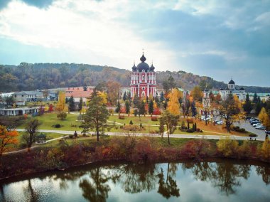Aerial shot of Curchi Monastery at daylight. Autumn warm colors. Moldova landmarks clipart