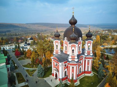 Aerial shot of Curchi Monastery at daylight. Autumn warm colors. Moldova landmarks clipart