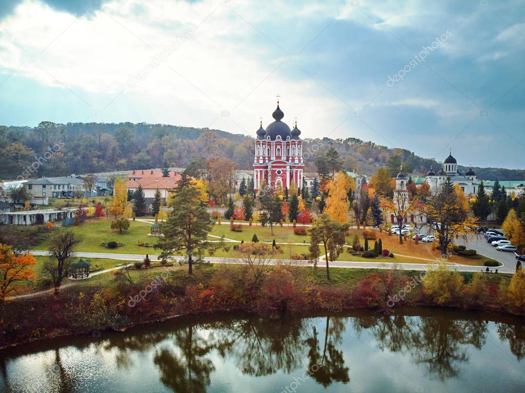 Aerial shot of Curchi Monastery at daylight. Autumn warm colors. Moldova landmarks