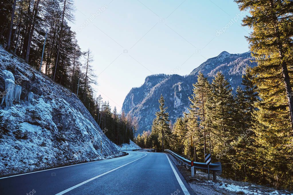 Road in the mountains of Toblach municipality at sunset. Italy beauties