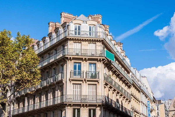 A French building during midday. Colourful enviroment with no clouds in the sky. Bright sun and harsh shadows. Shot in Paris France
