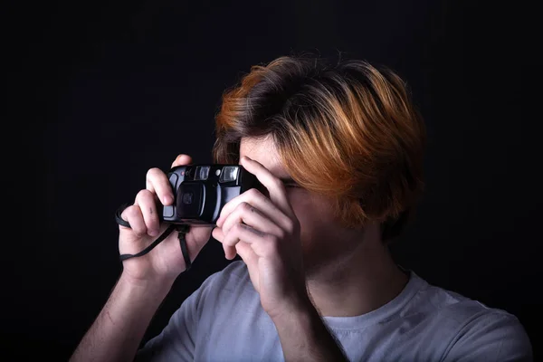 Young caucasian adult with old photo camera — Stock Photo, Image
