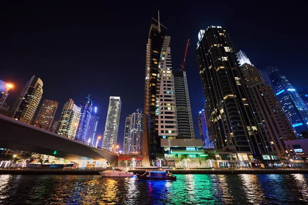 Dubai Marina at night with colorful touristic boats — Stock Photo, Image