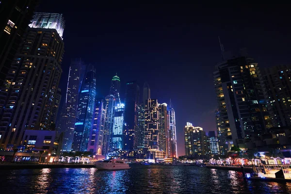 Dubai Marina at night with colorful touristic boats — Stock Photo, Image