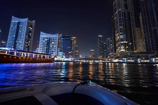 Dubai Marina at night with colorful touristic boats — Stock Photo, Image