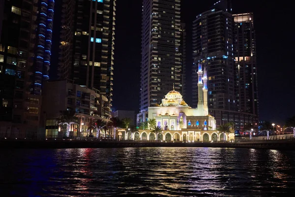 Dubai Marina at night with colorful touristic boats — Stock Photo, Image