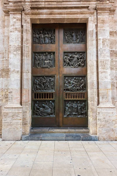 Big door on the streets of Valencia with focus on Romanesque architecture style
