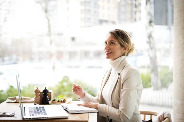 Happy young charming woman in white suite