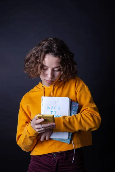 Young caucasian girl holding notebook with Back to School — Stock Photo, Image