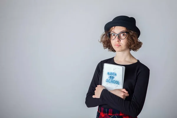 Young caucasian highschool girl posing in the studio — Stock Photo, Image