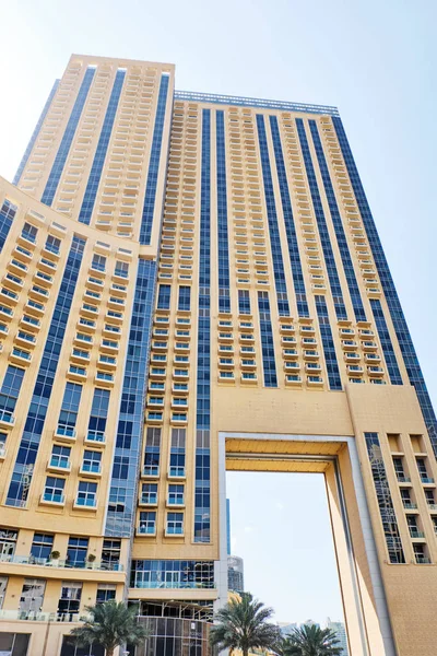 Tall yellow hotel from bottom view — Stock Photo, Image