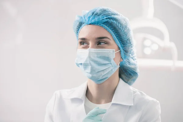 Young caucasian woman in the dentistry with a mask on her face — Stock Photo, Image