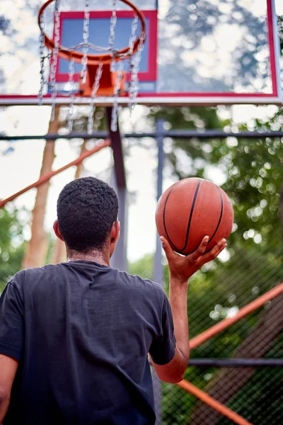 Black basketball player playing in the field