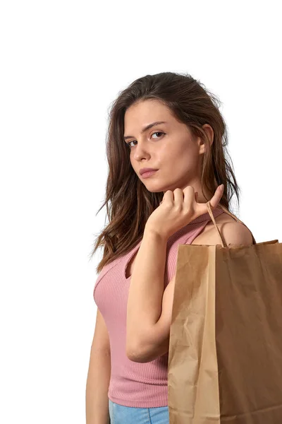Young caucasian white girl holding paper bag with finger — Stock Photo, Image