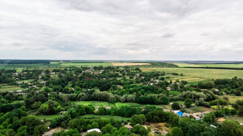 Donduseni with greenery, fields on the background, view from the drone in Moldova