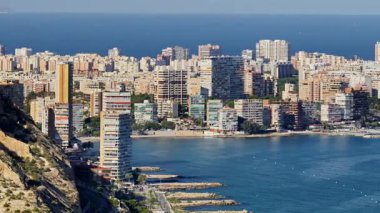 Northward view across coves and residential towers of Albufereta with the sea beyond