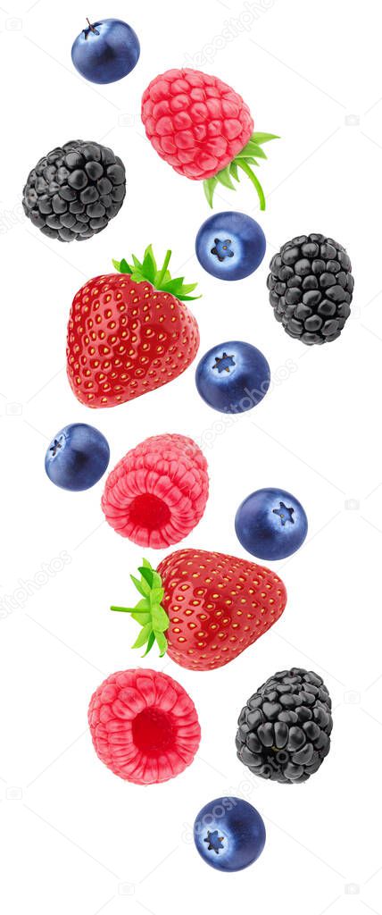Creative composition with falling berries isolated on a white background.