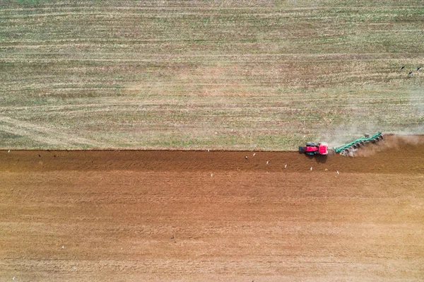 Tractor working in field