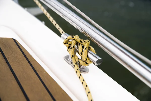 Sailing sport. Elements of modern yacht cleat with knot on yacht head.