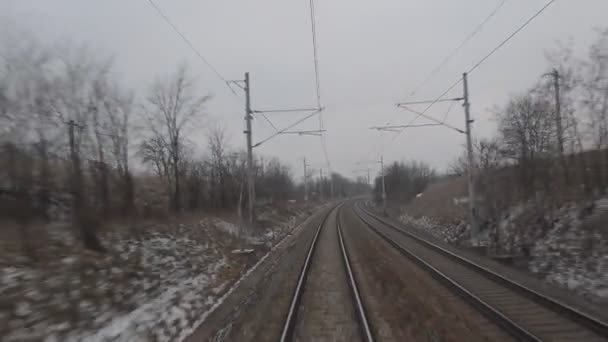 View from the last coach of high-speed suburban train. Railroad view from the last wagon of a passenger train. 4K — Stock Video