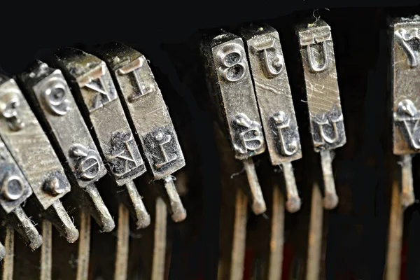 Close up of antique typewriter typebars, great concept for blogs, journalism, news or the mass media — Stock Photo, Image