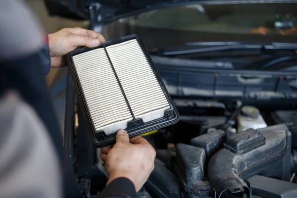 Hand a man change and check air filter of car in the engine room — Stock Photo, Image