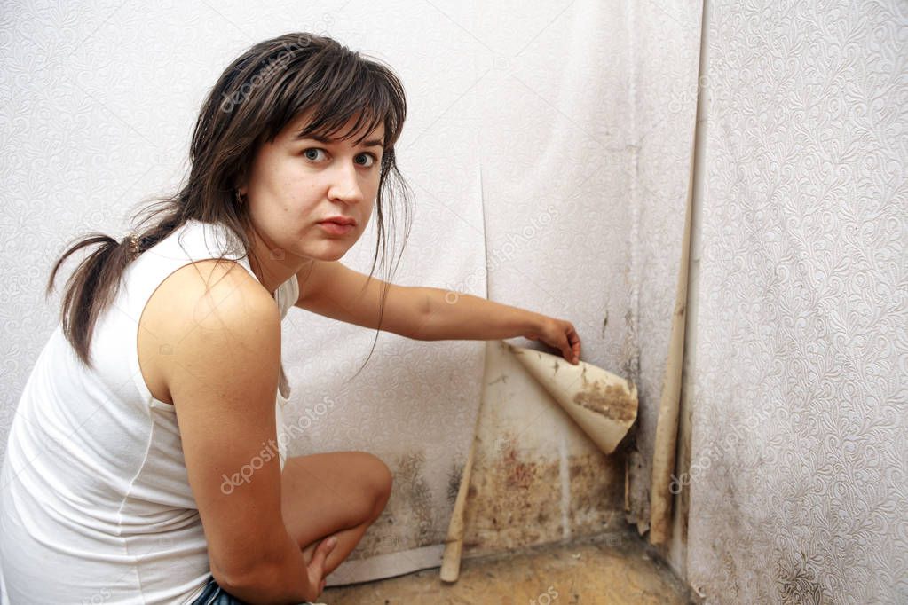 A girl removing Mold fungus without respirator mask