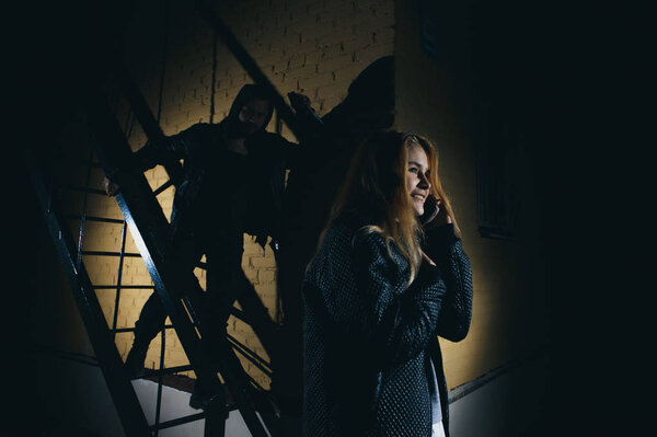 crime concepts robbery concepts a robber aimed his sharp knife at a woman to rob her valuable things in bag