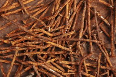 Paslı çivi. Soyut metal arka plan.