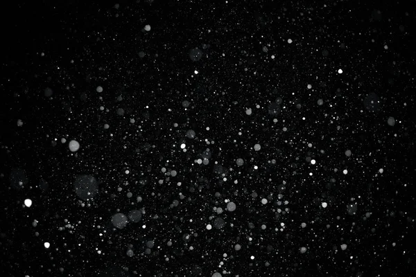 Falling snow on black background. — Stock Photo, Image