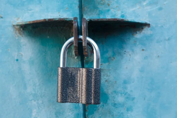 Check-lock on the brown wooden table background — Stock Photo, Image