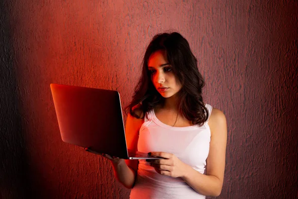 sad and scared female teenager with computer laptop suffering cyberbullying and harassment being online feeling desperate and humiliated in cyber bullying