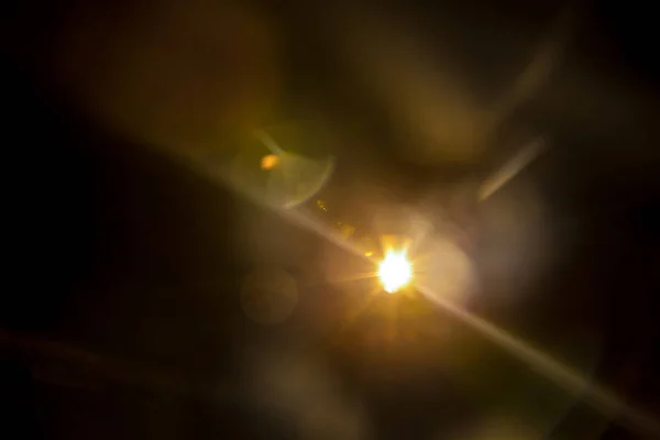 Abstract Natural Sun flare on the black — Stock Photo, Image
